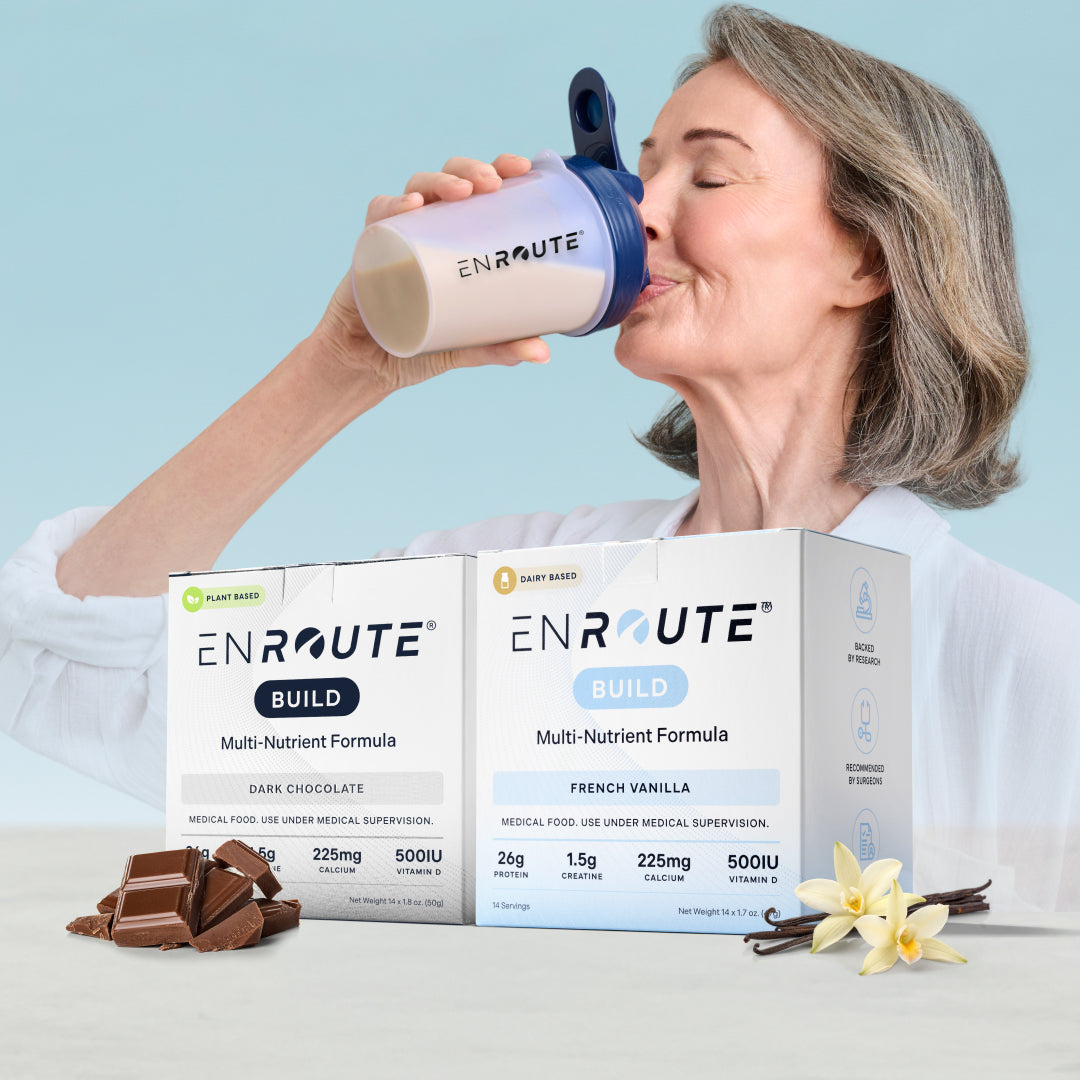 Woman drinking from an EnRoute supplement shaker with packaging and ingredients displayed.